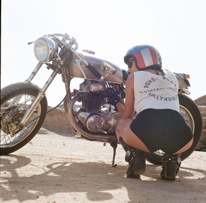 A playful frame from Girls on a motorcycle — online in Moscow